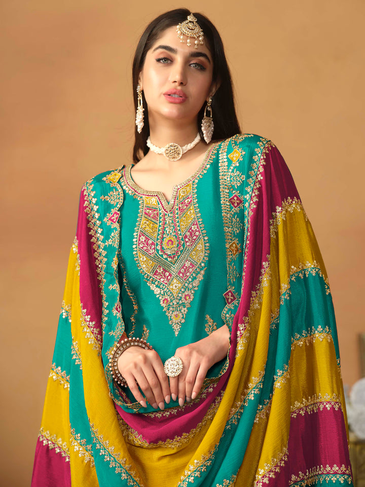 Luxurious teal green chinon silk salwar kameez adorned with exquisite heavy embroidery and sequins, ideal for weddings.