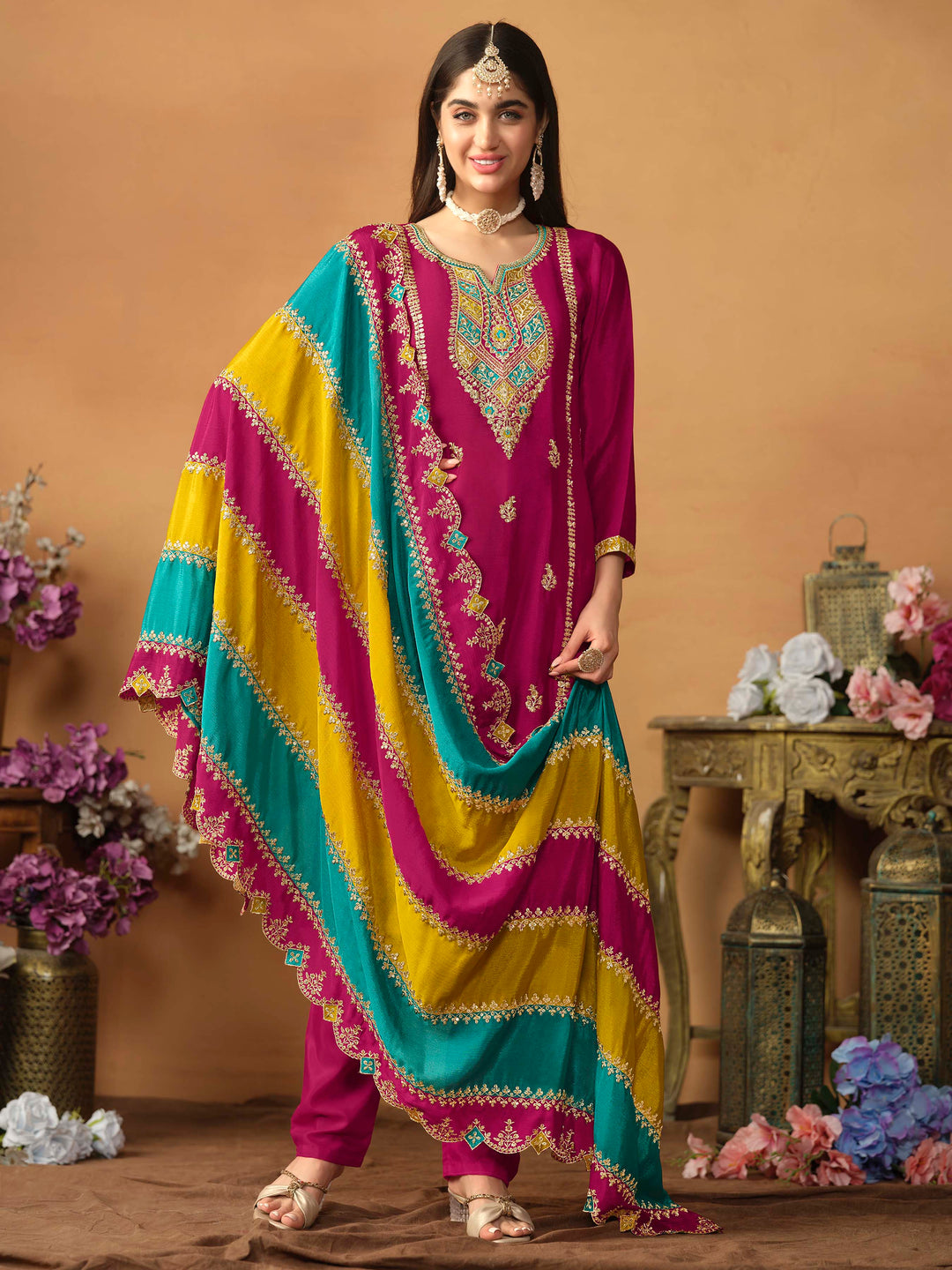 Elegant rani pink chinon silk salwar kameez featuring heavy thread embroidery and sequins, perfect for special occasions.