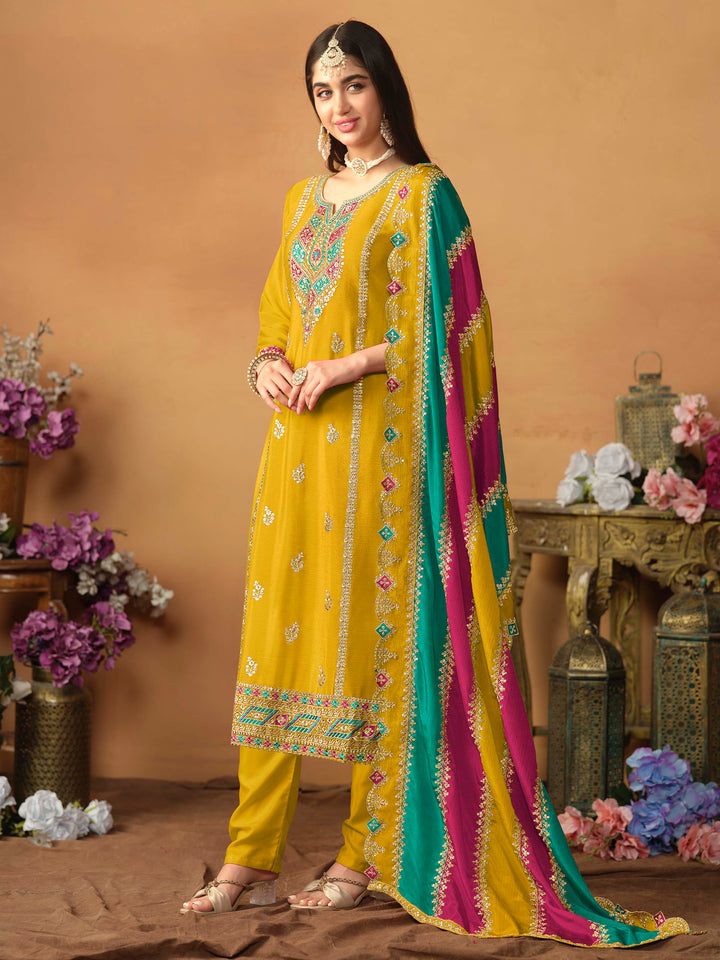 Elegant mustard salwar kameez in chinon silk with intricate thread embroidery and shimmering sequin work for special events.