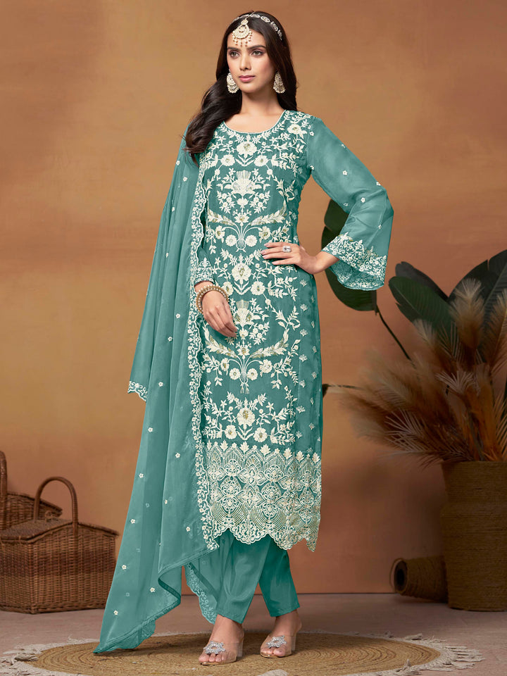 Elegant teal soft organza salwar kameez featuring heavy thread embroidery and sequins, perfect for festive occasions.