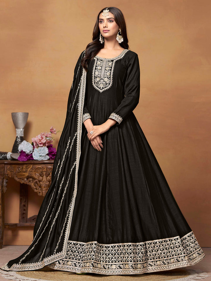 Elegant black art silk salwar kameez featuring heavy thread embroidery and sequins, perfect for formal occasions.