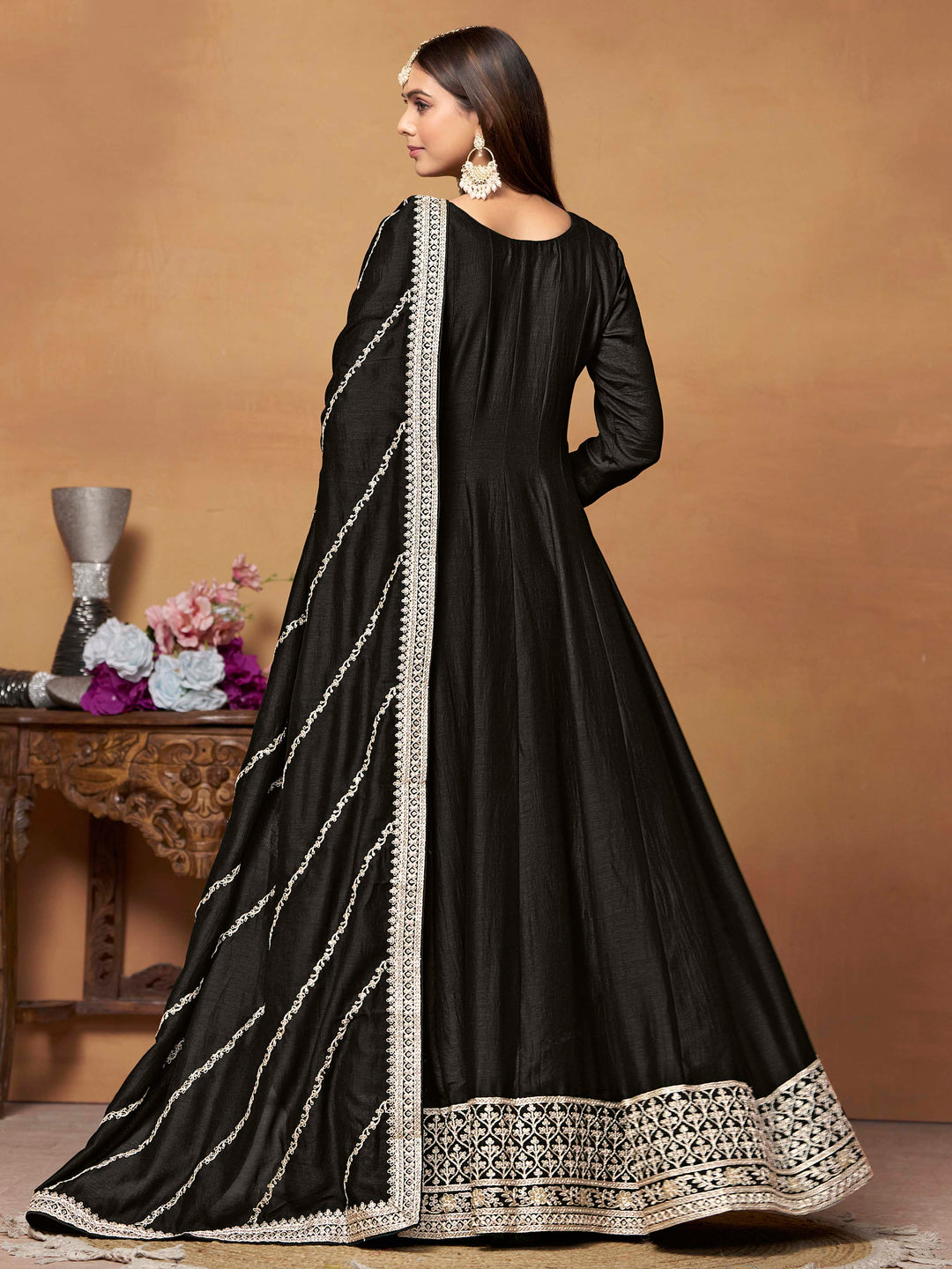 Luxurious black art silk salwar kameez adorned with exquisite heavy embroidery and sequins, ideal for weddings.