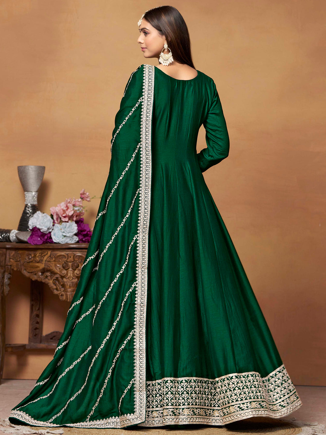 Luxurious dark green art silk salwar kameez adorned with exquisite heavy embroidery and sequins, ideal for weddings.