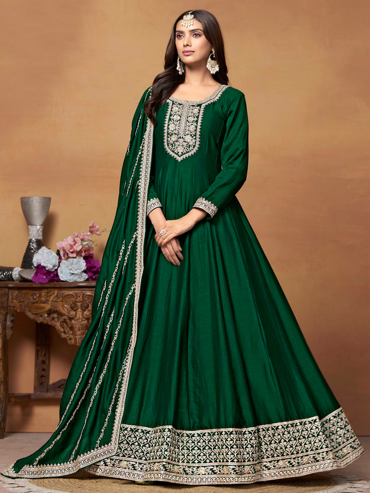 Elegant dark green art silk salwar kameez featuring heavy thread embroidery and sequins, perfect for special occasions.