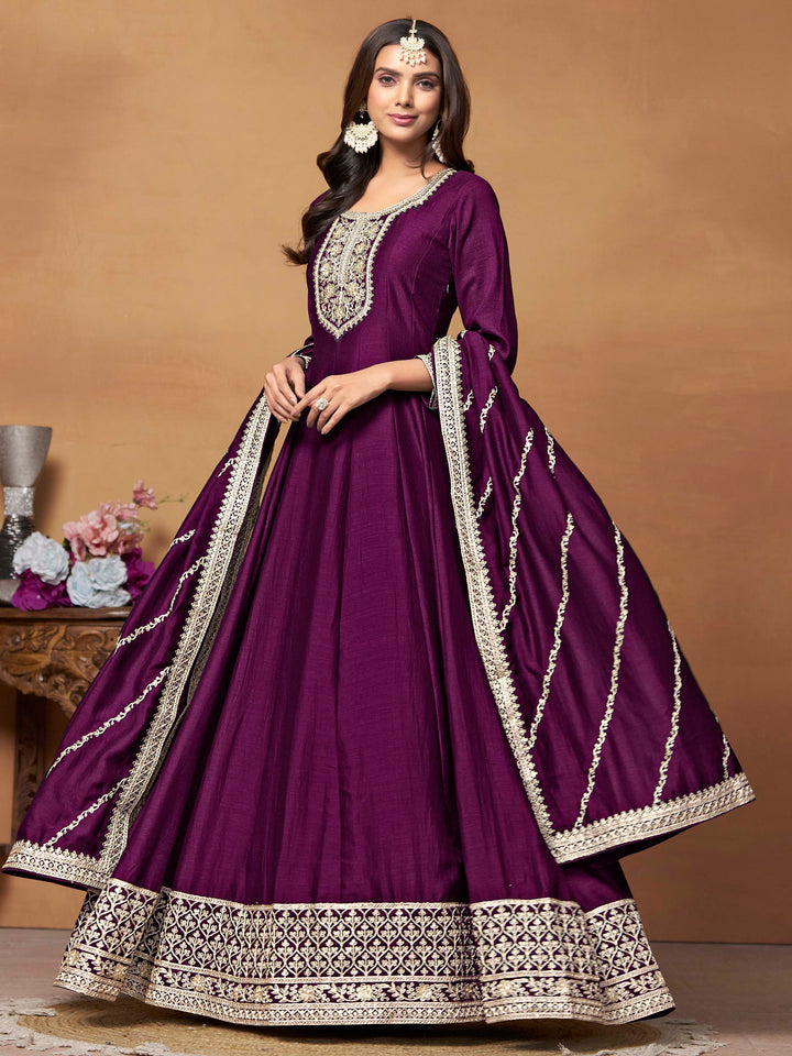 Elegant magenta salwar kameez in art silk with intricate thread embroidery and shimmering sequin work for special events.