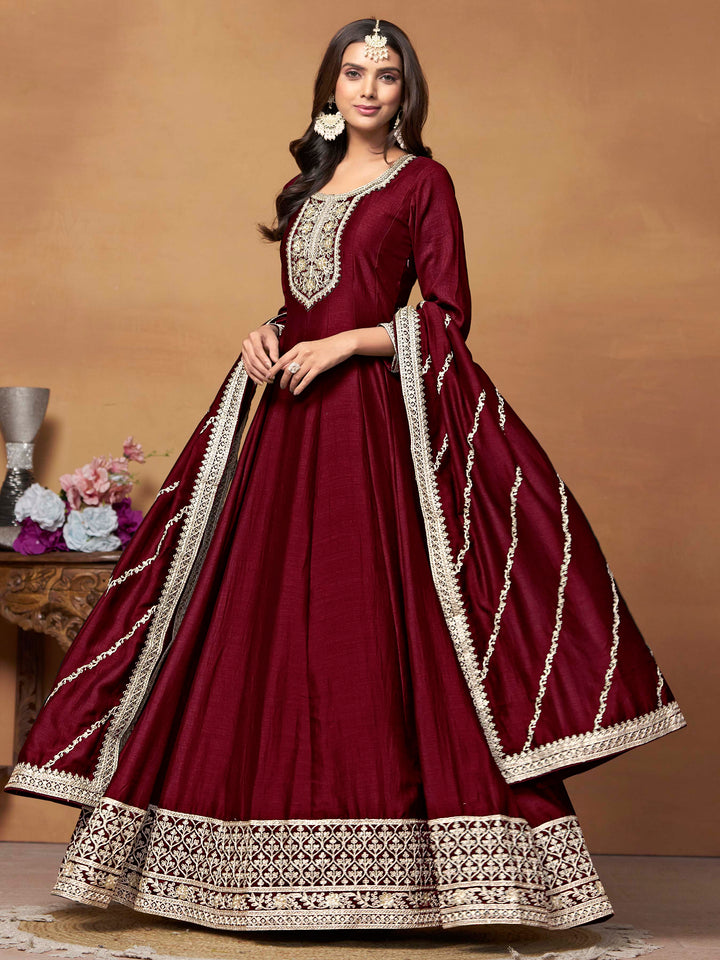 Stunning maroon salwar kameez in art silk with intricate thread embroidery and shimmering sequin work for special events.