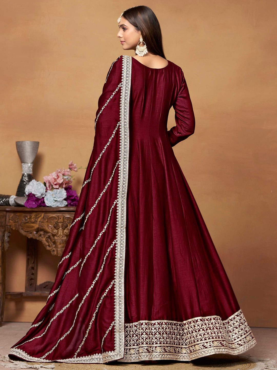 Luxurious maroon art silk salwar kameez adorned with exquisite heavy embroidery and sequins, ideal for weddings.