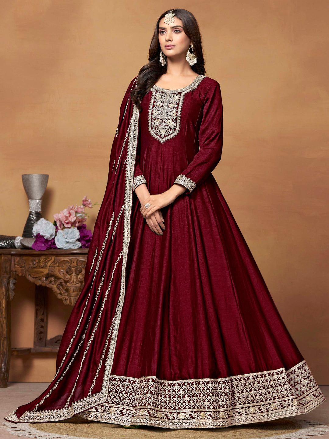 Elegant maroon art silk salwar kameez featuring heavy thread embroidery and sequins, perfect for festive occasions.