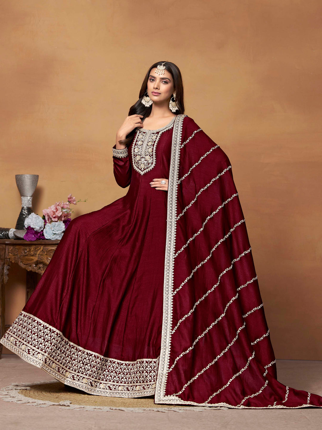 Beautiful maroon salwar kameez crafted from art silk, showcasing intricate heavy thread and sequin embellishments.