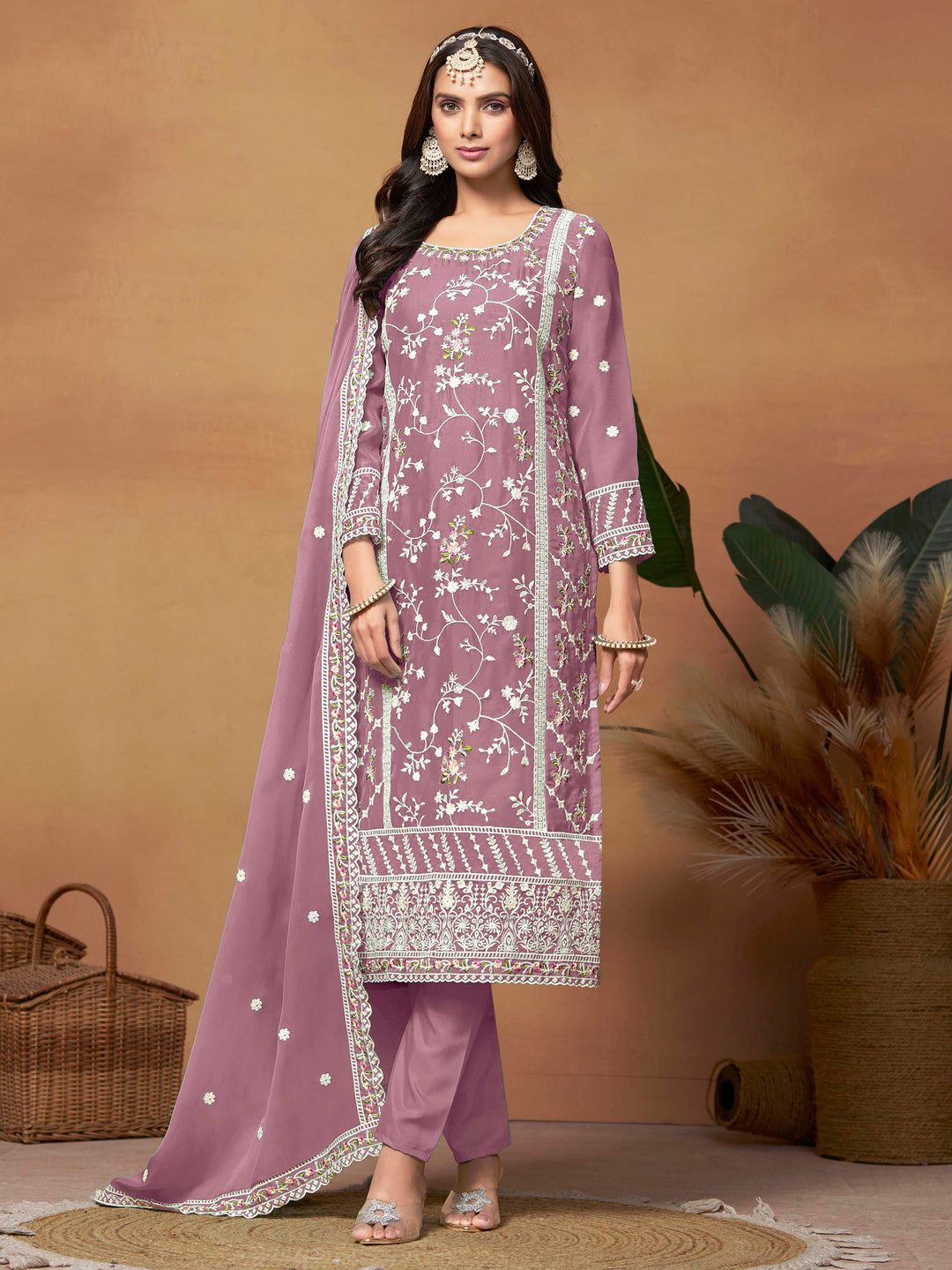 Stunning onion pink soft organza salwar kameez featuring heavy thread embroidery and sequins, perfect for special occasions.