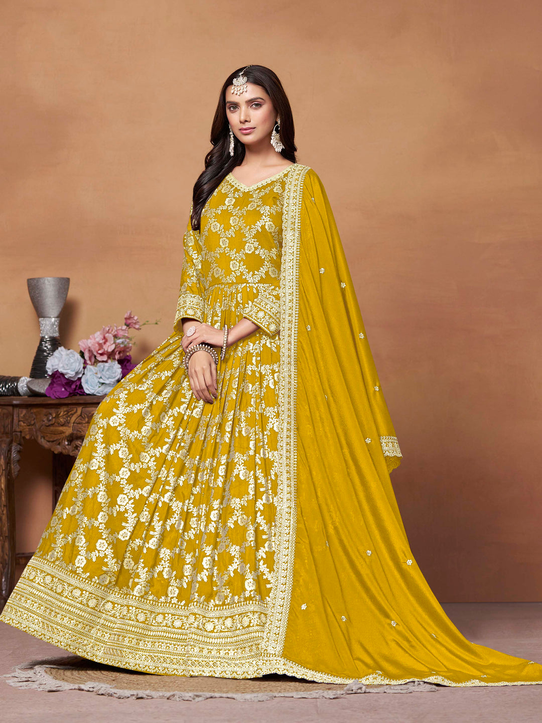 Beautiful mustard salwar kameez crafted from dola jacquard, showcasing intricate thread embroidery and a stylish design.