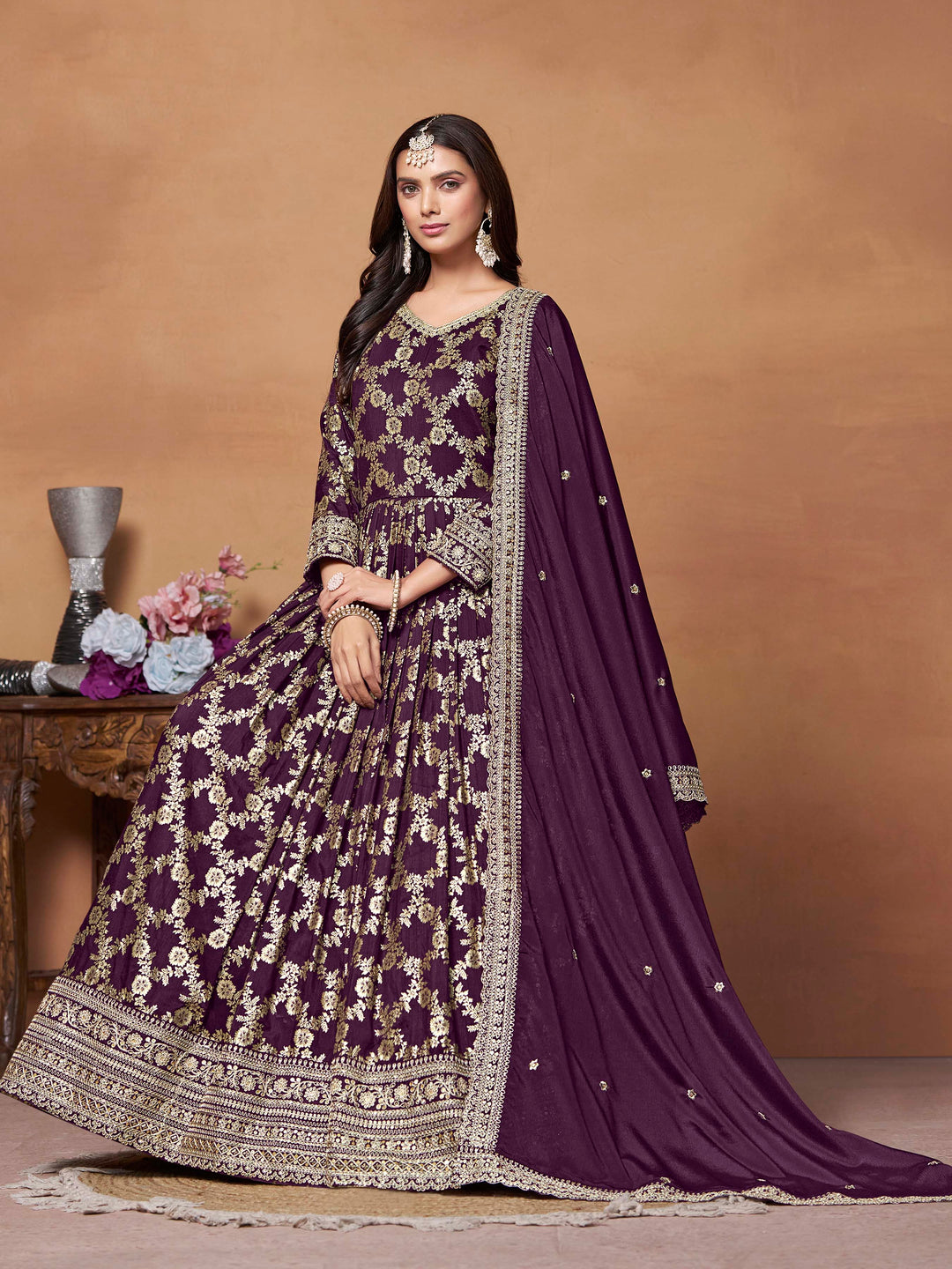 Beautiful purple salwar kameez crafted from dola jacquard, showcasing intricate thread embroidery and a stylish design.