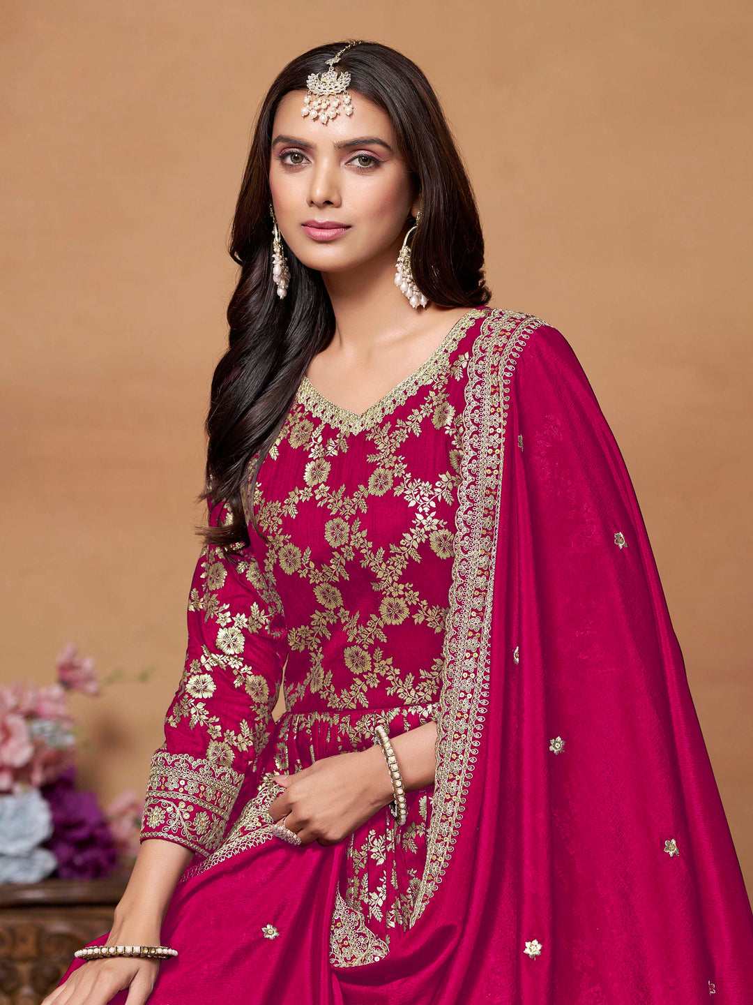 Elegant rani pink salwar kameez in dola jacquard with exquisite thread embroidery, ideal for festive events.