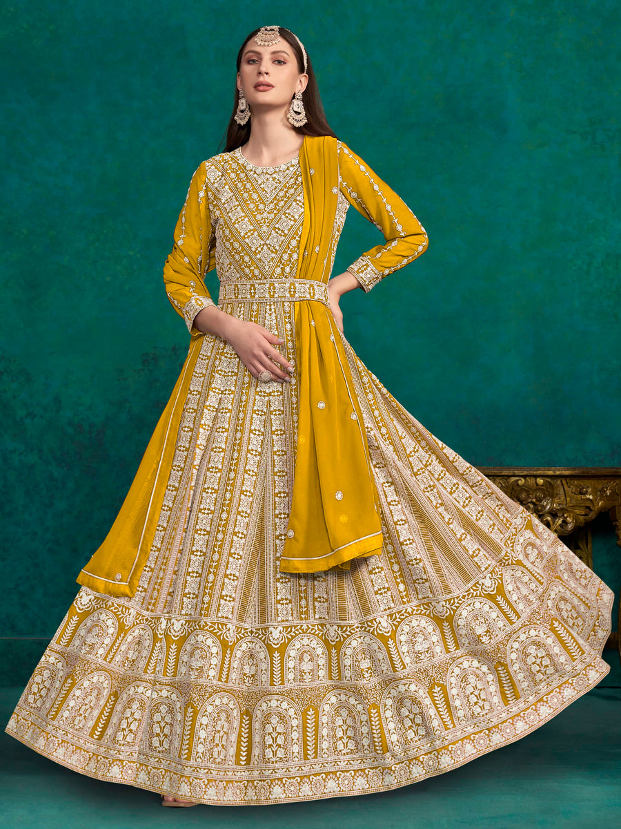 Elegant mustard faux georgette salwar kameez featuring heavy thread embroidery and sequins, perfect for festive occasions.