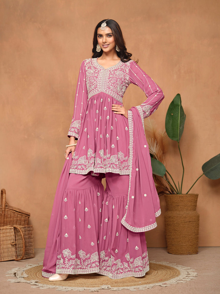 Gorgeous pink faux georgette salwar kameez with heavy thread embroidery and sharara bottom, ideal for festive celebrations.