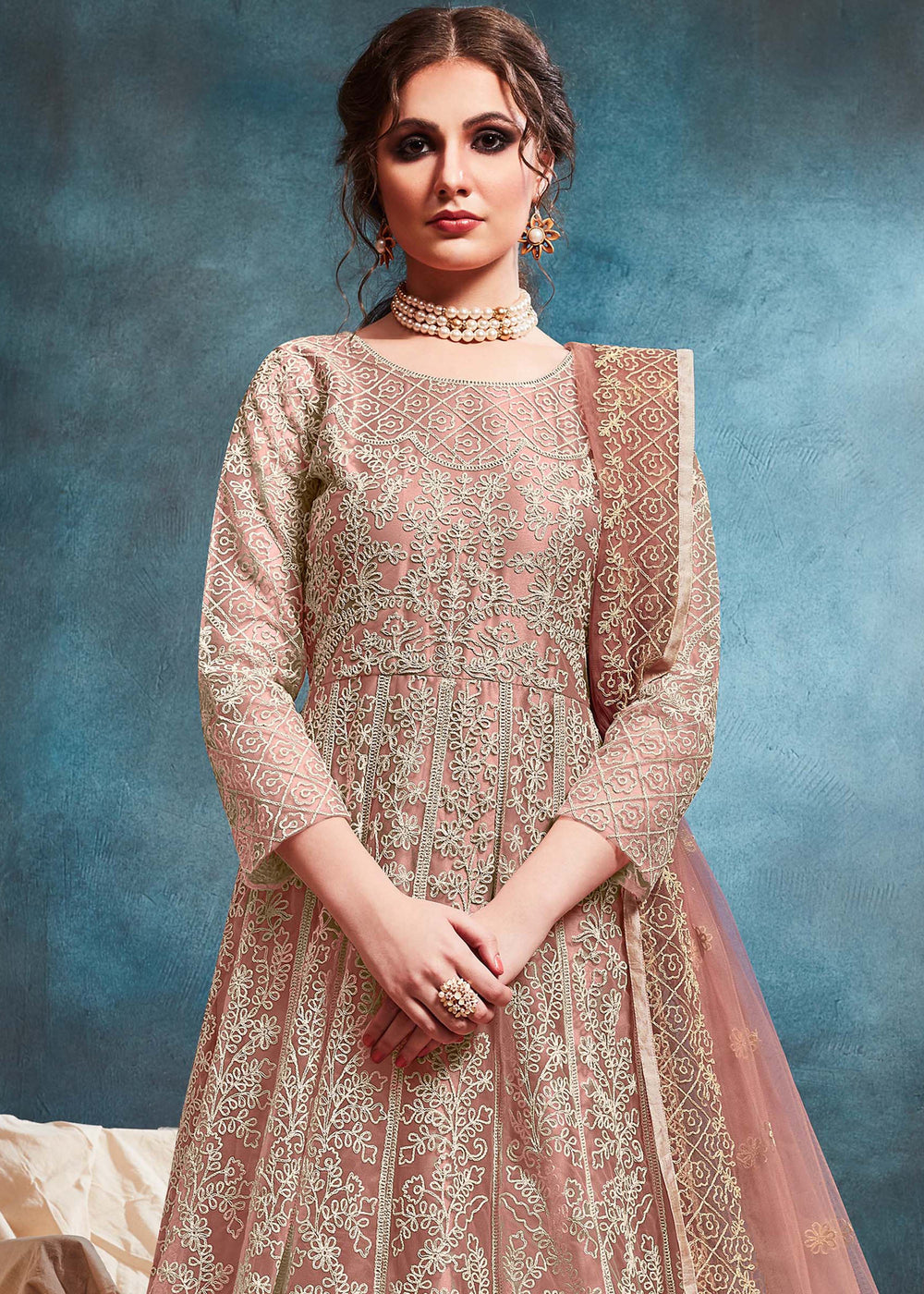 Chic peach salwar kameez showcasing intricate detailing, designed for modern women celebrating special occasions in the USA.