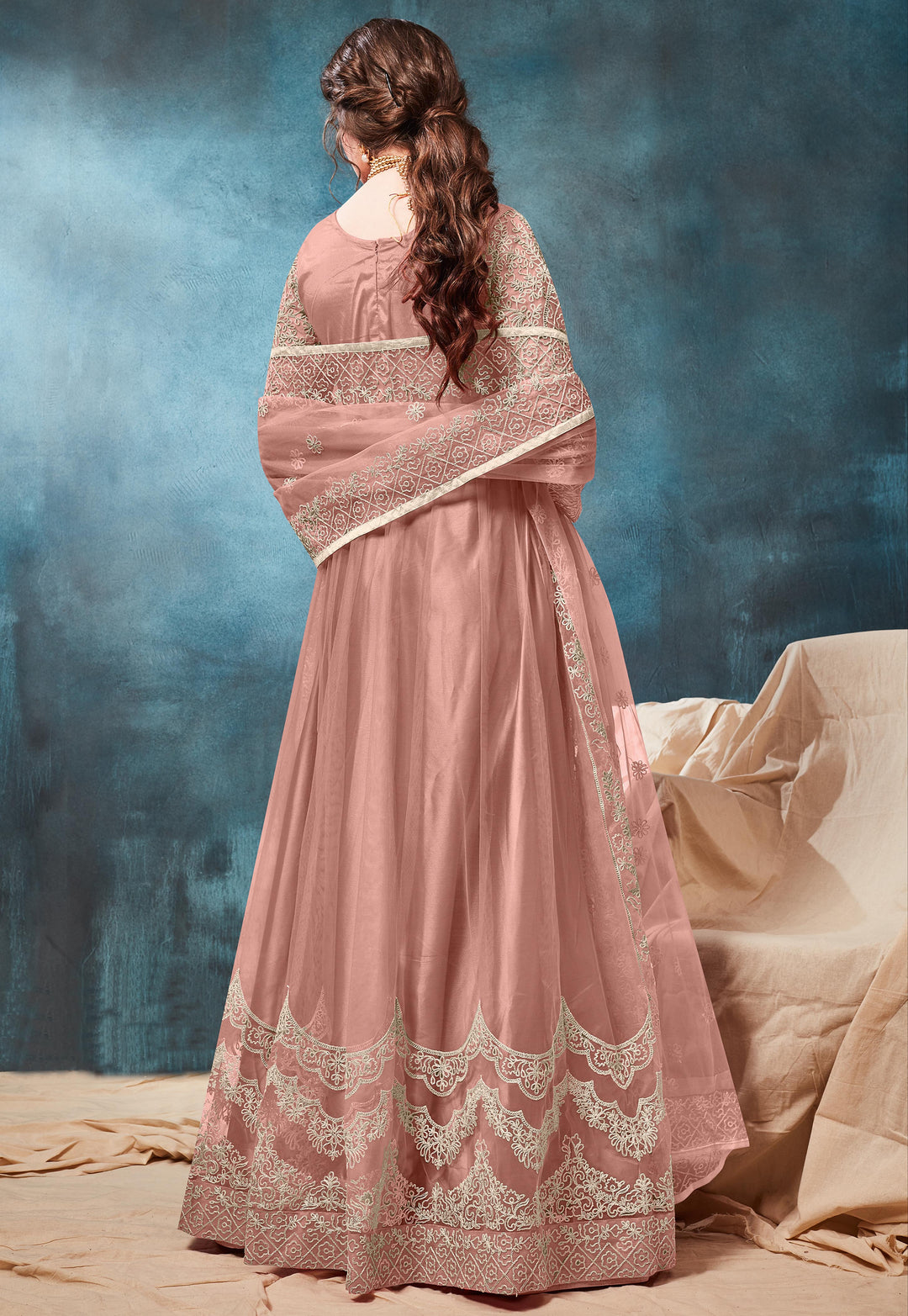 Beautifully crafted peach traditional salwar kameez set, ideal for weddings and festive gatherings with luxurious fabric.