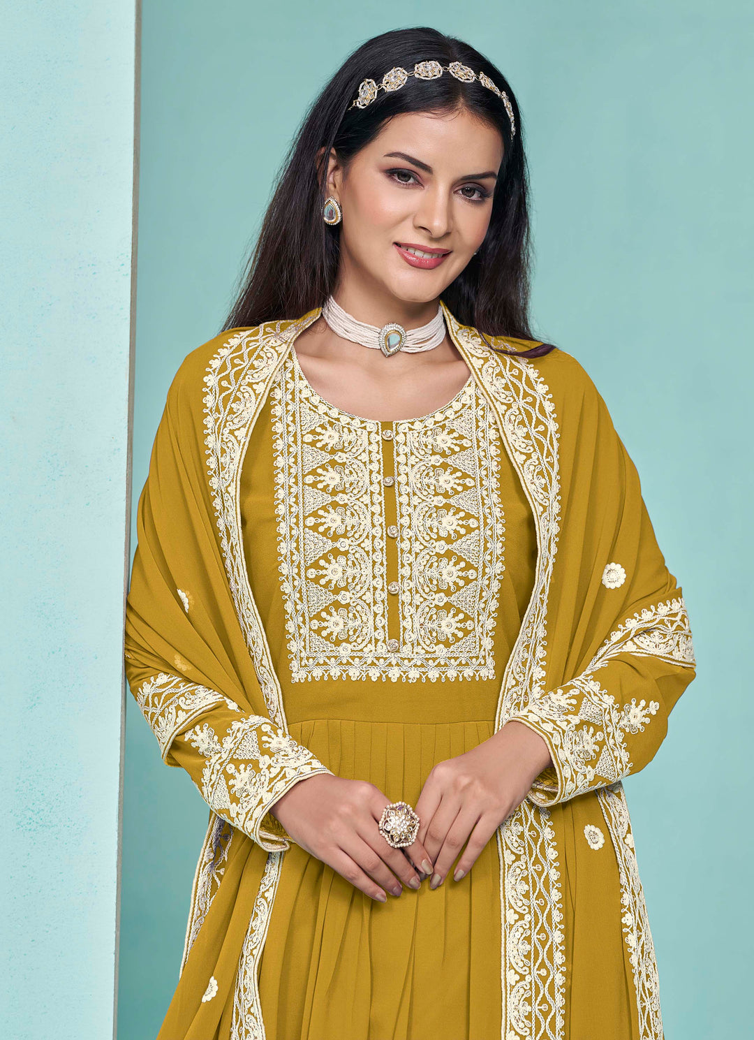 Beautiful mustard faux georgette salwar kameez showcasing exquisite heavy thread embroidery and sequins work, ideal for weddings.