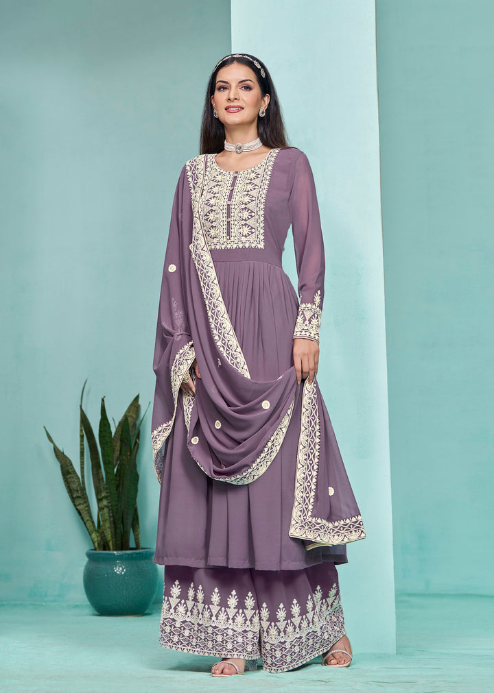 Elegant purple faux georgette salwar kameez adorned with heavy thread embroidery and sequins, perfect for festive occasions.