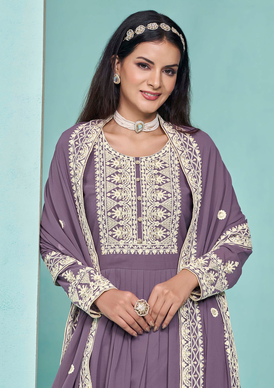 Beautiful purple faux georgette salwar kameez showcasing exquisite heavy thread embroidery and sequins work, ideal for weddings.