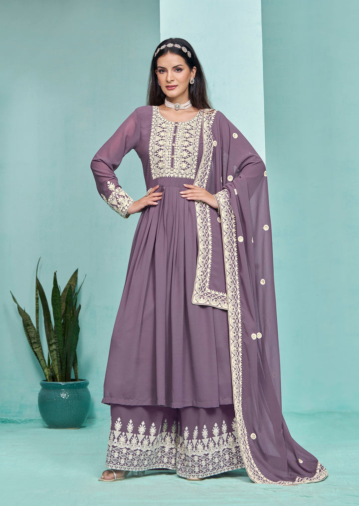 Gorgeous purple faux georgette salwar kameez featuring intricate heavy thread embroidery and sequins work, designed with palazzo bottom.