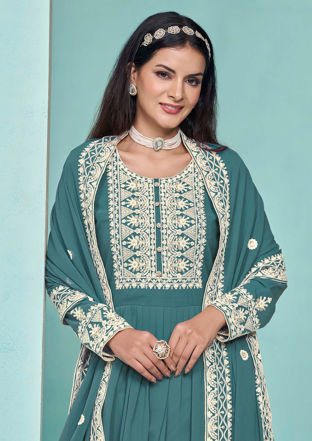 Beautiful teal faux georgette salwar kameez showcasing exquisite heavy thread embroidery and sequins work, ideal for weddings.