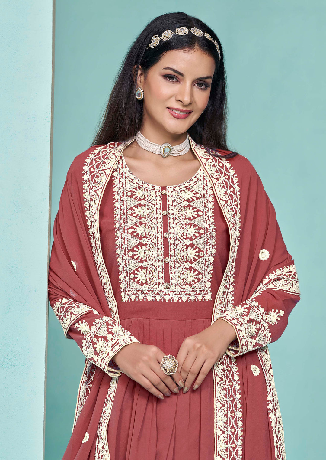 Stunning brick faux georgette salwar kameez showcasing exquisite heavy thread embroidery and sequins work, ideal for weddings.