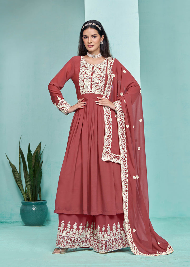 Elegant brick faux georgette salwar kameez featuring intricate heavy thread embroidery and sequins work, designed with a palazzo bottom.