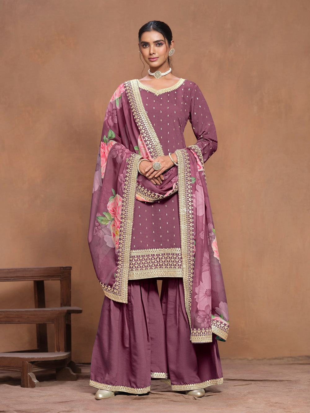 Elegant mauve Roman silk salwar kameez adorned with intricate heavy thread embroidery and a vibrant printed dupatta, perfect for celebrations.