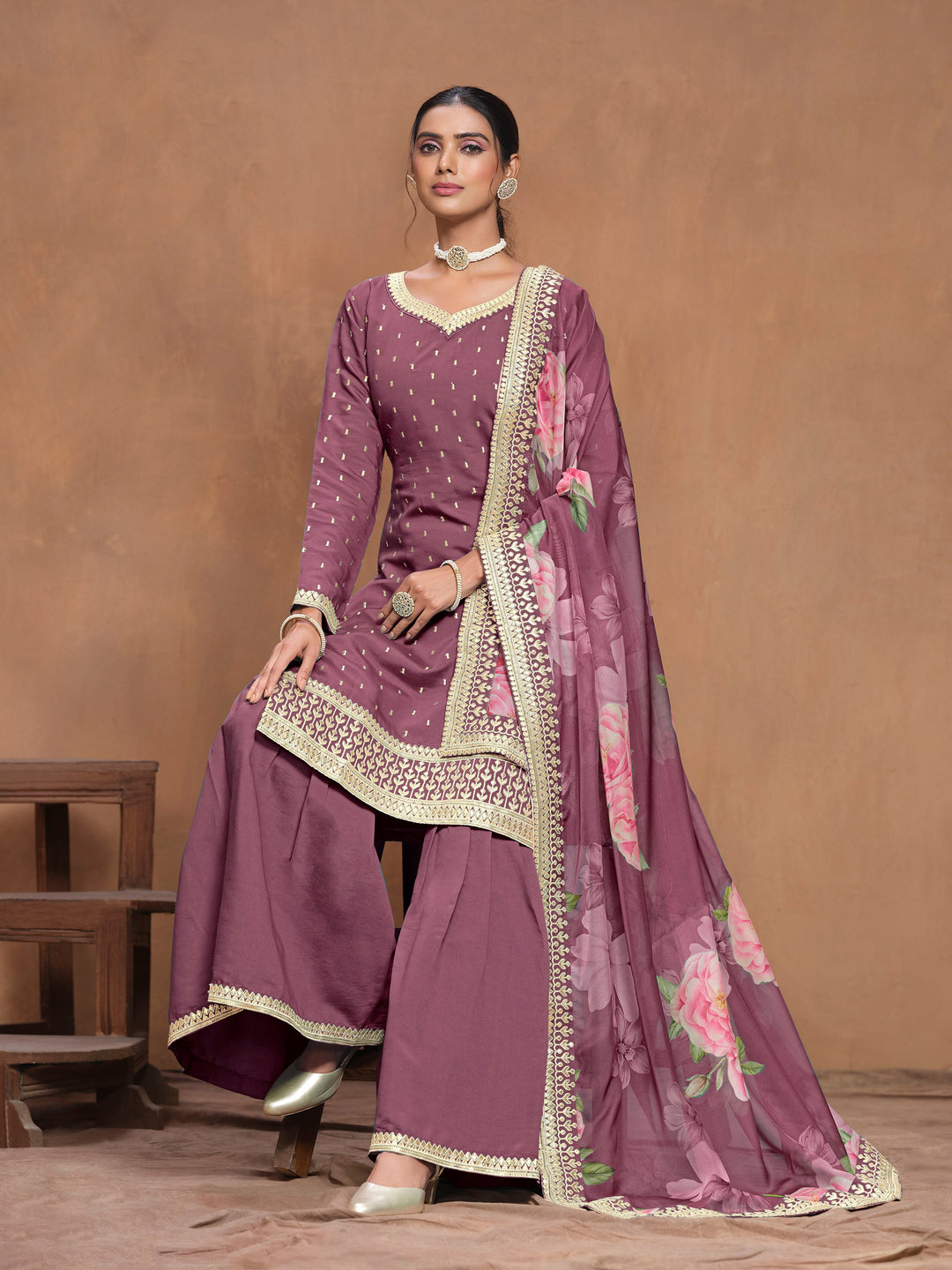 Beautiful mauve Roman silk salwar kameez showcasing exquisite heavy thread embroidery and a printed dupatta, ideal for weddings.