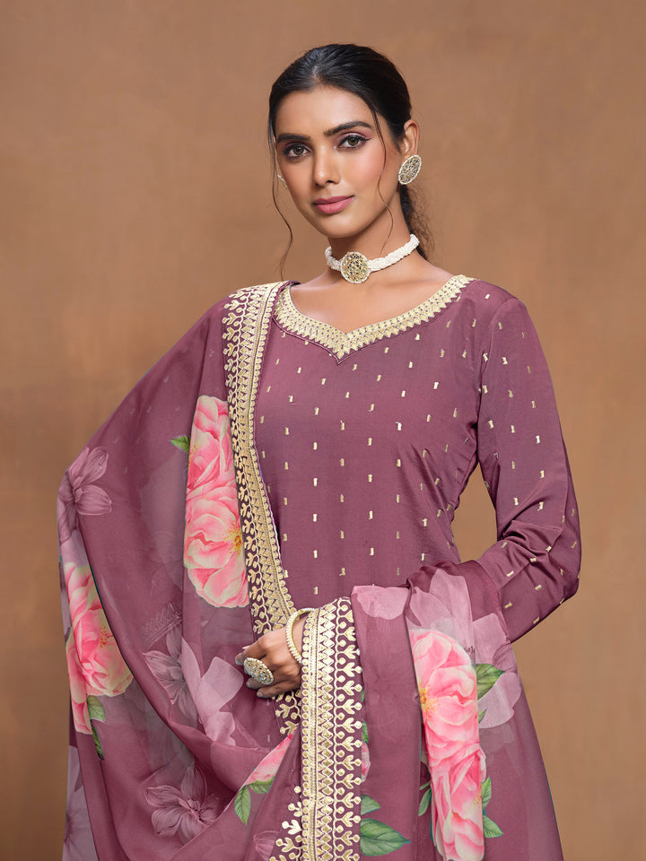 Chic mauve Roman silk salwar kameez with heavy thread embroidery and a stunning printed dupatta, great for cultural festivities.