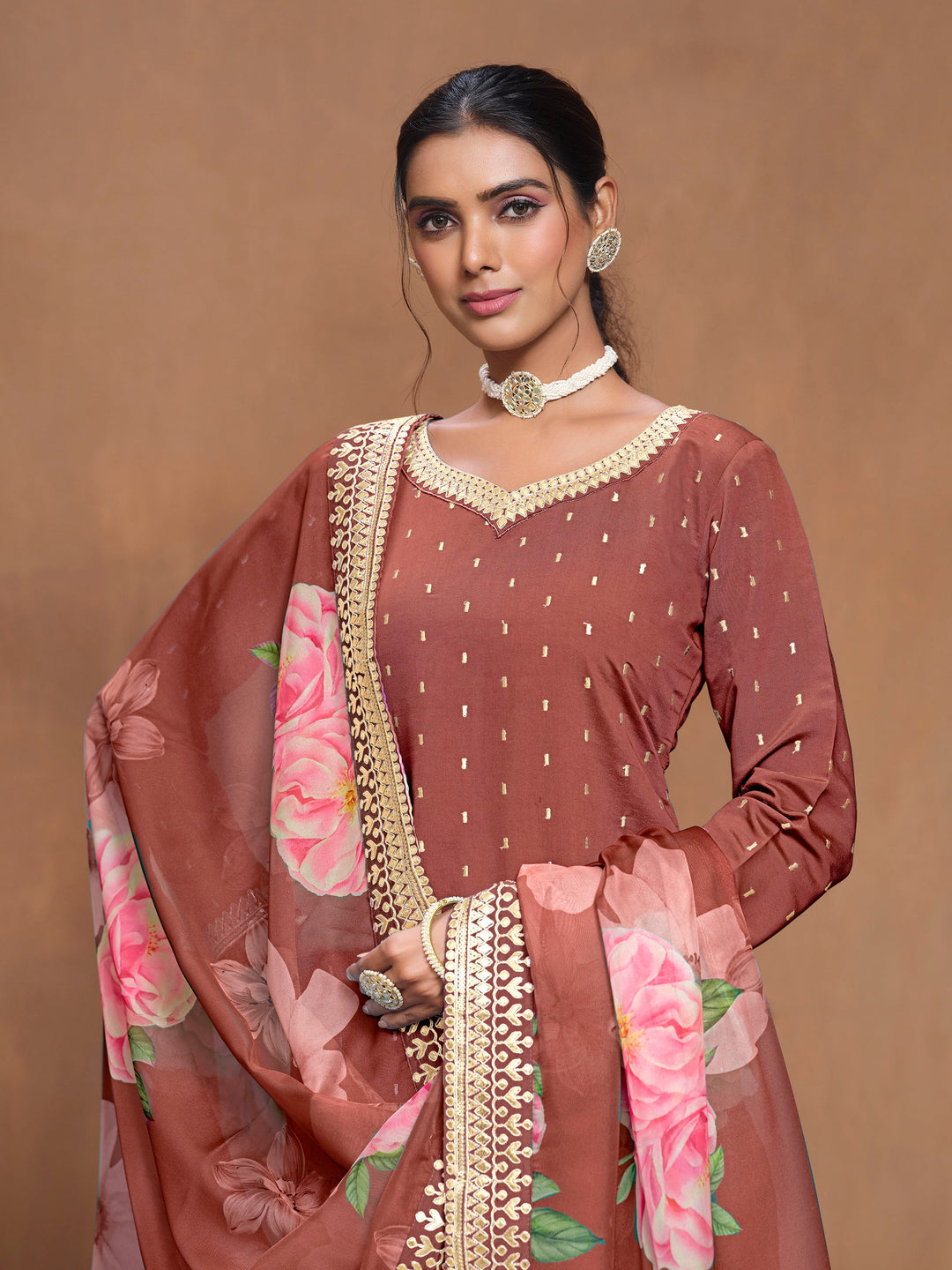 Chic brick brown Roman silk salwar kameez with beautiful heavy thread embroidery and a vibrant printed dupatta, great for cultural festivities.