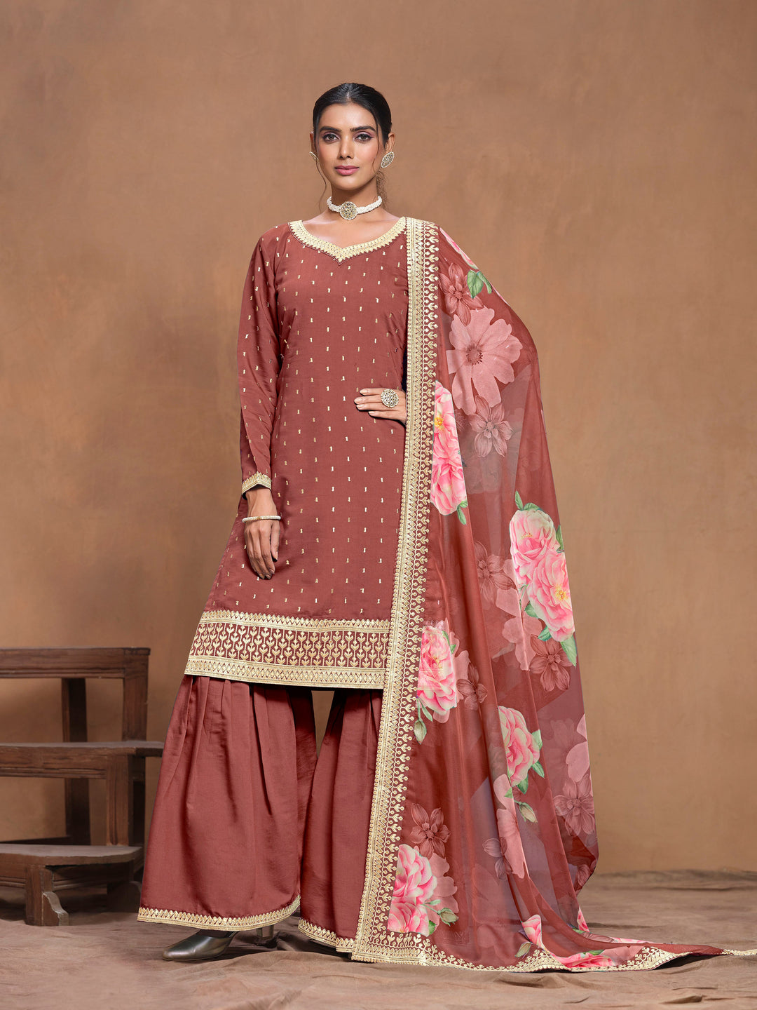 Elegant brick brown Roman silk salwar kameez featuring intricate heavy thread embroidery and a printed dupatta, designed with a palazzo bottom.