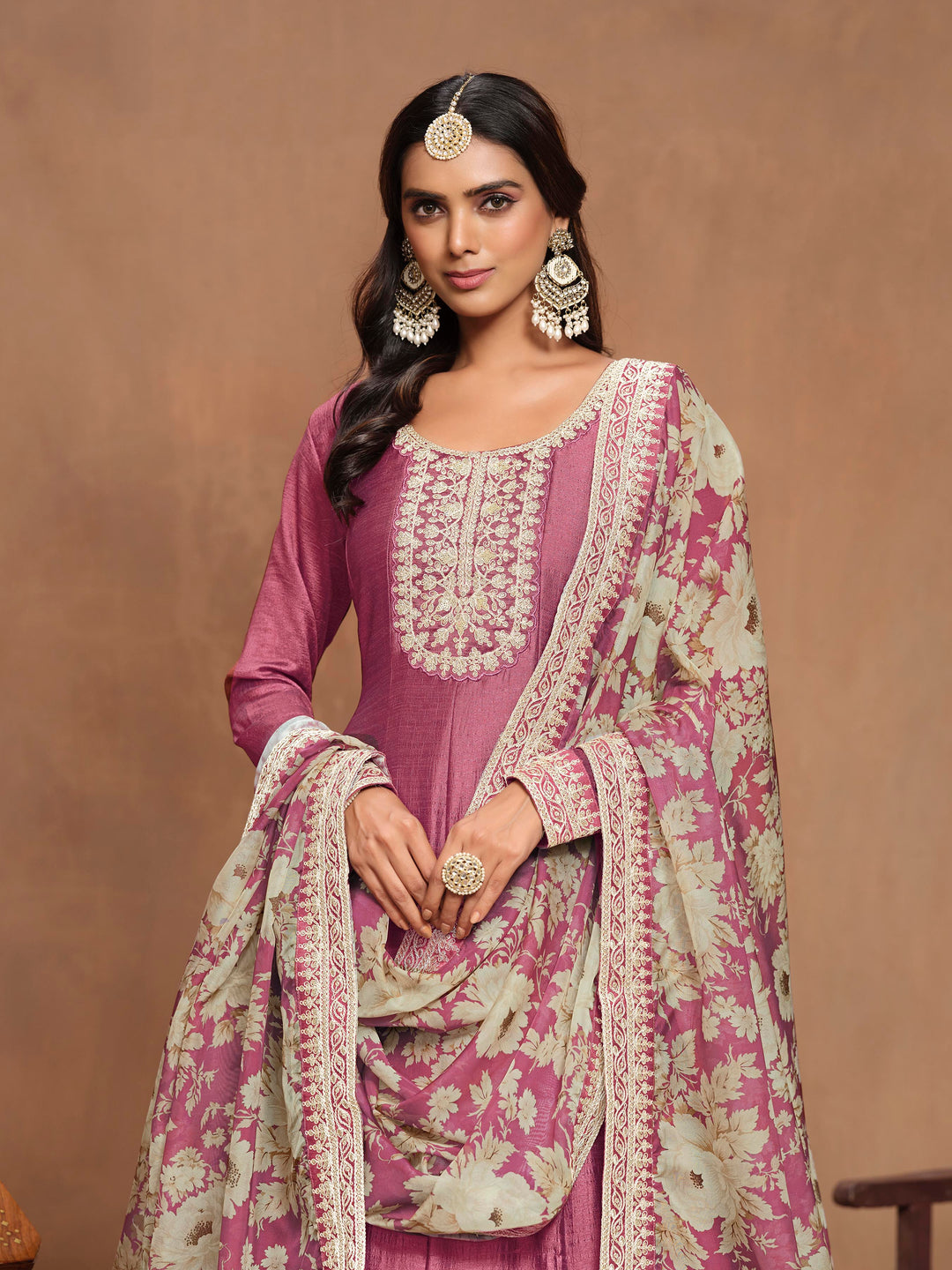 Chic hot pink art silk salwar kameez with intricate heavy thread embroidery and sequins, designed to impress for cultural events.