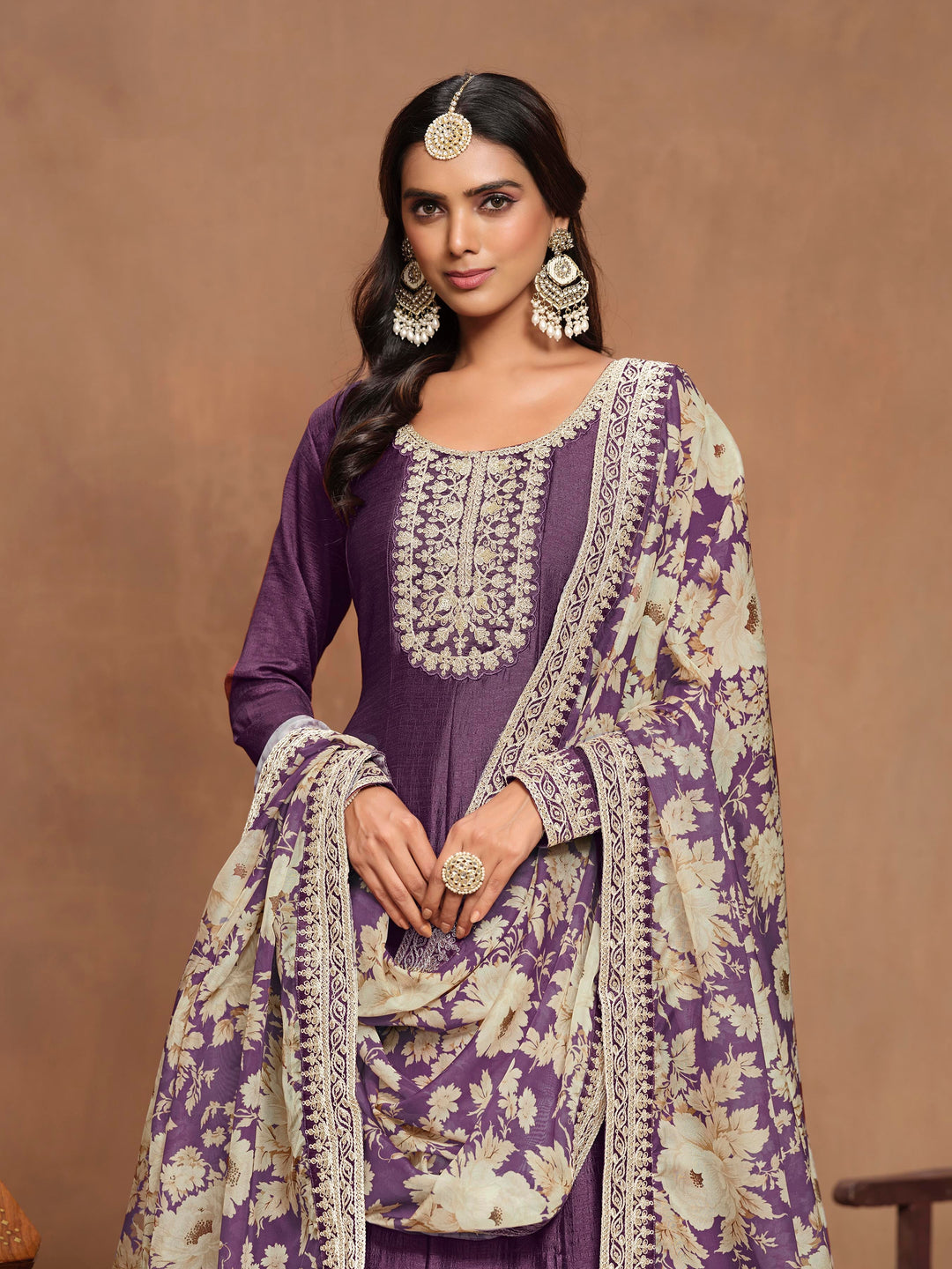 Chic purple art silk salwar kameez with intricate heavy thread embroidery and sequins, designed to make a statement at cultural events.