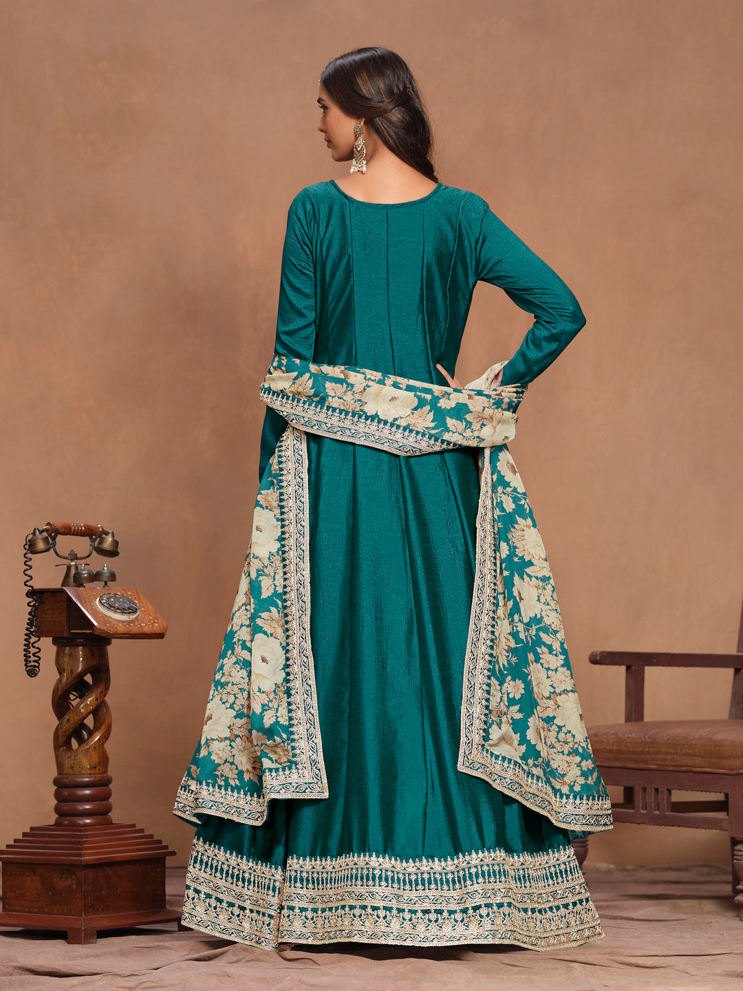 Stunning teal art silk salwar kameez showcasing exquisite heavy thread embroidery with sequins work and a stylish printed dupatta.