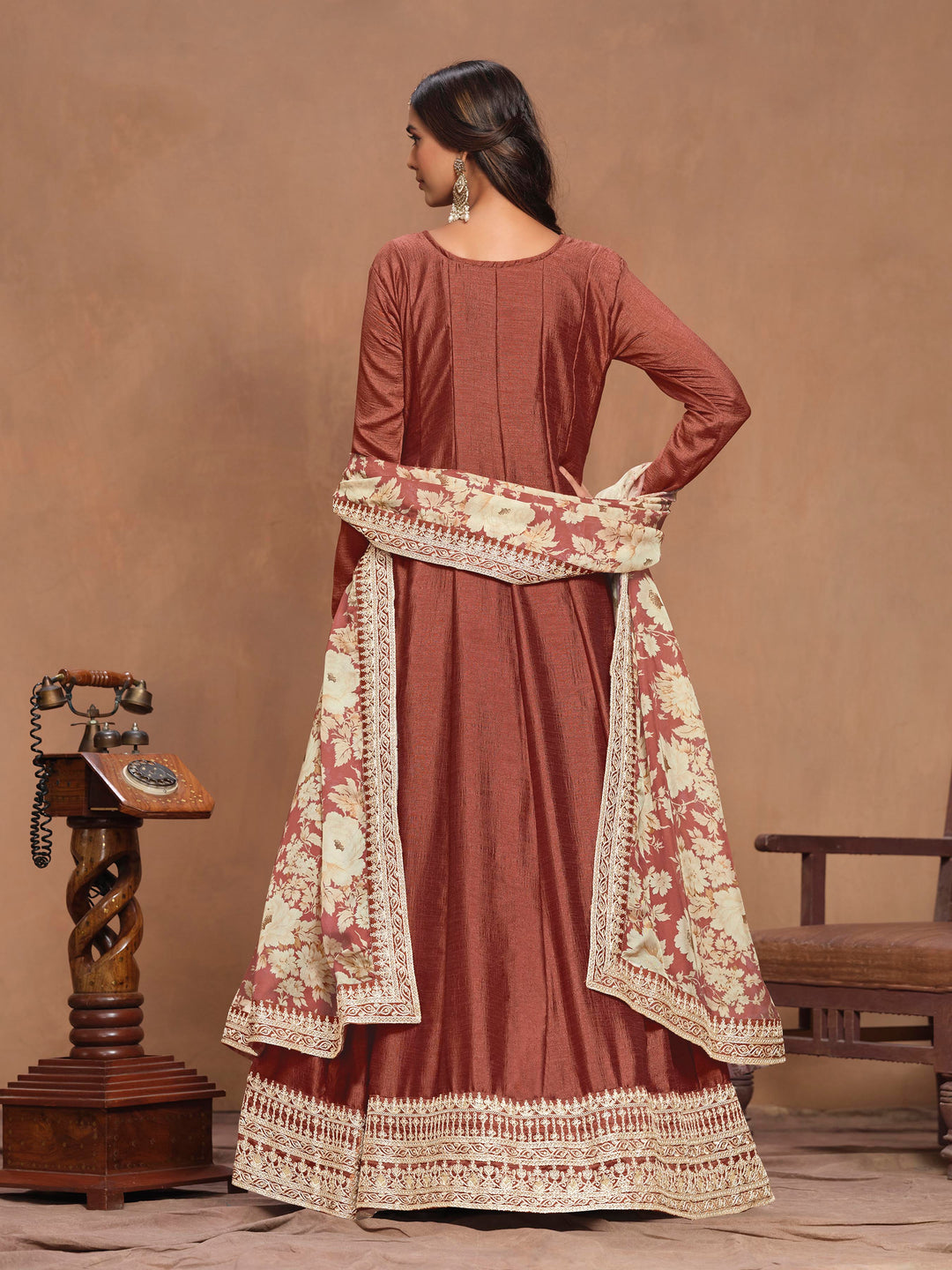 Chic rust brown art silk salwar kameez showcasing beautiful heavy thread embroidery with sequins work and a vibrant printed dupatta.