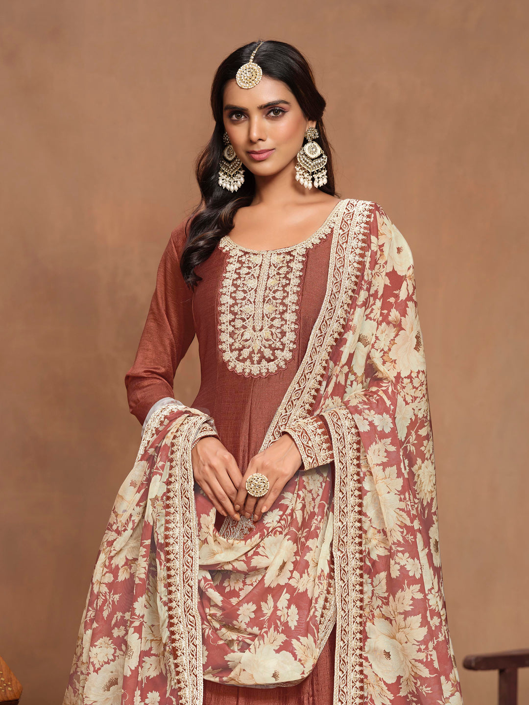 Gorgeous rust brown art silk salwar kameez with intricate heavy thread embroidery and sequins, designed to make a statement at cultural events.