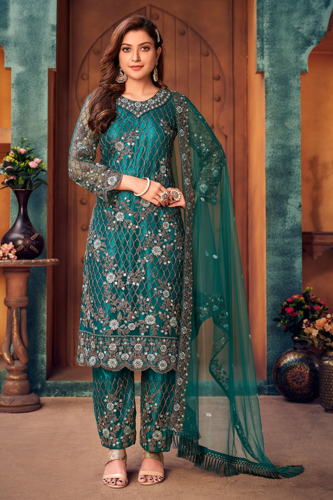 Radiant teal green salwar kameez for USA women, intricate traditional attire for special occasions.