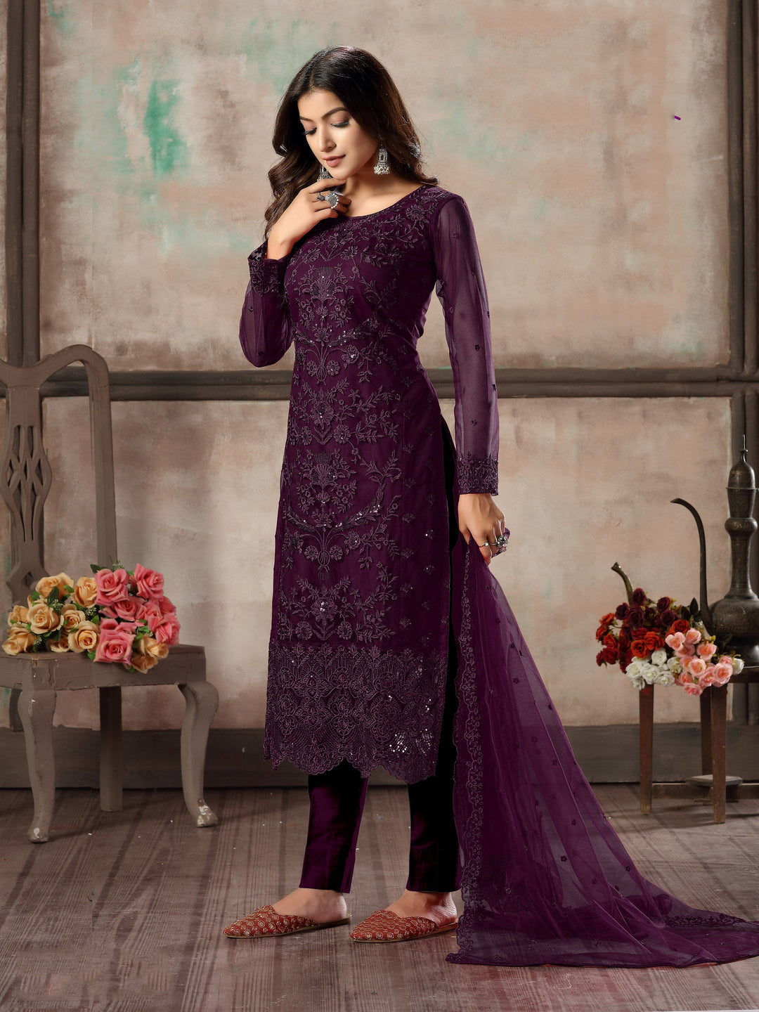 Women's purple salwar kameez set with exquisite embroidery for weddings.