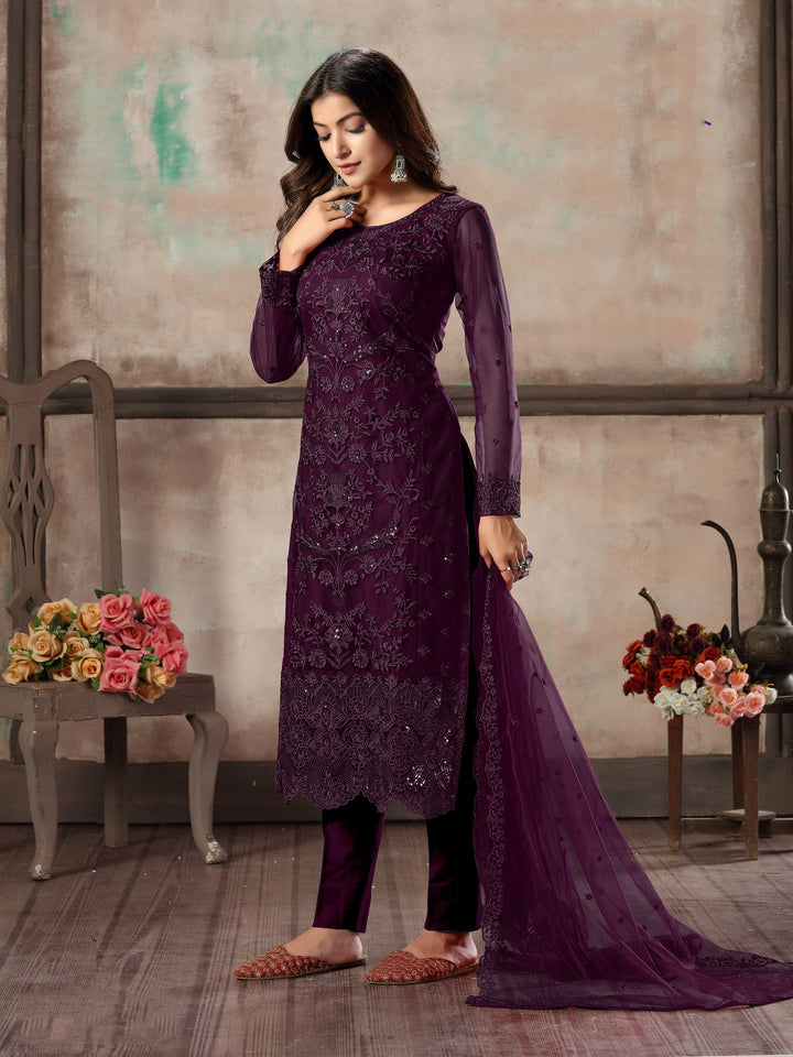 Women's purple salwar kameez set with exquisite embroidery for weddings.