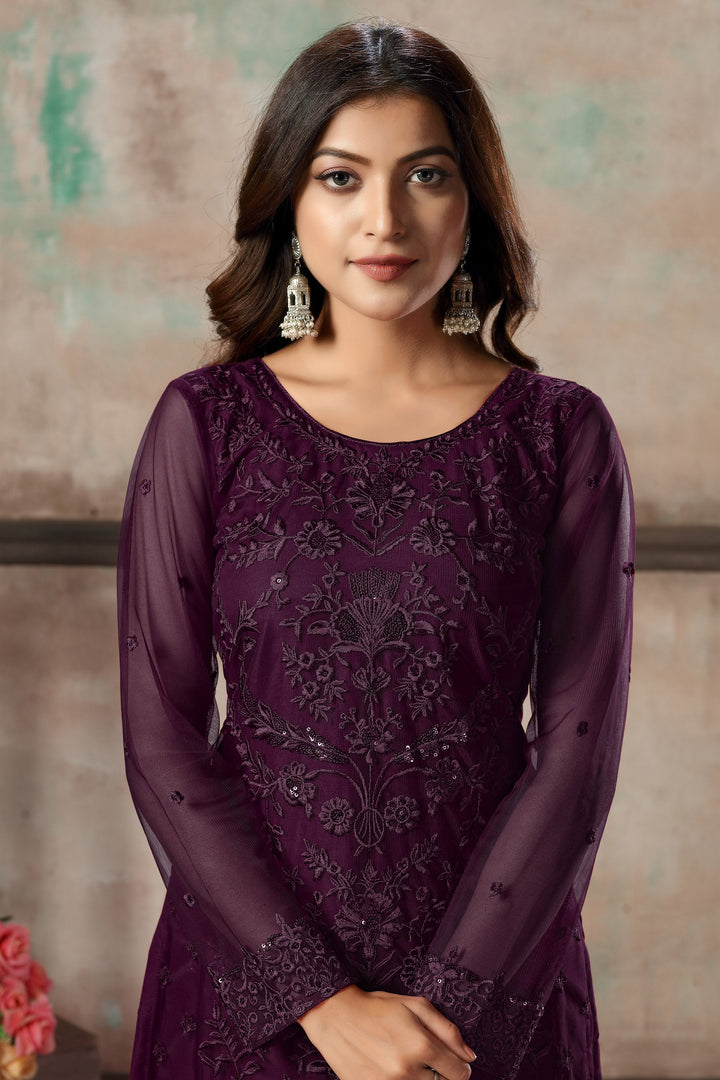 Traditional purple salwar kameez set for women's festive occasions.