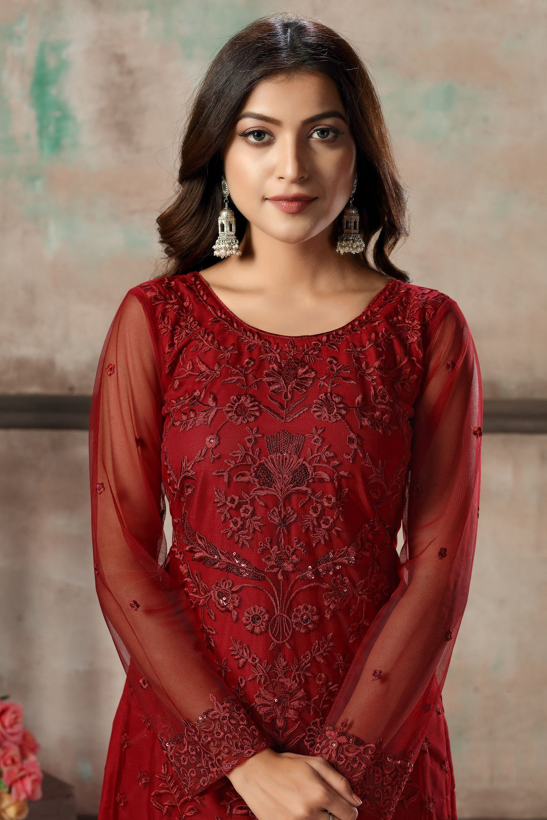 Red salwar kameez set for women, a classic choice for ethnic events.