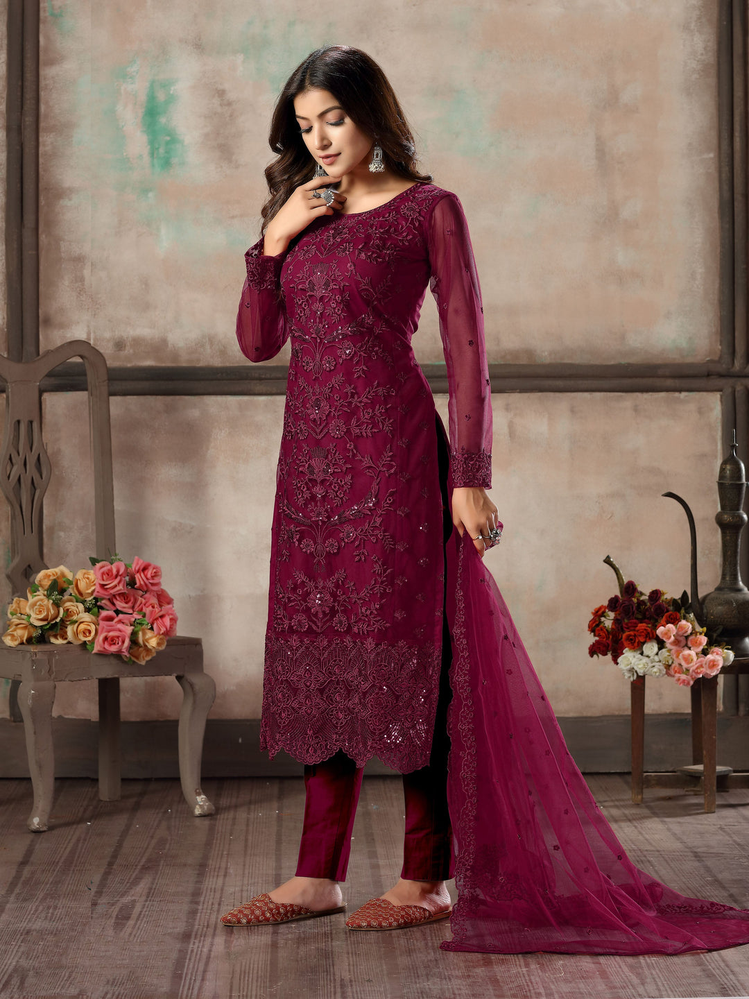 Women's elegant wine salwar kameez set for traditional celebrations.