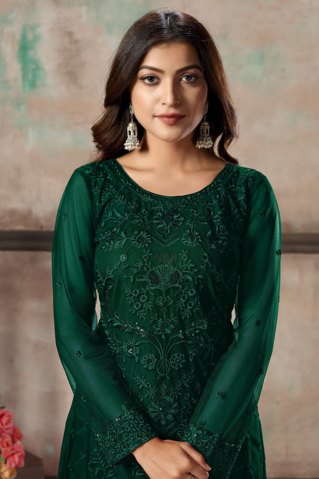 Women's green salwar kameez set with elegant design for special occasions.