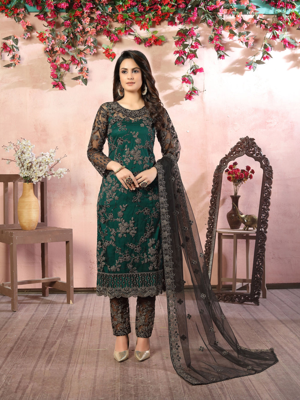 Women's Rama green salwar kameez set with intricate embroidery for a modern look.