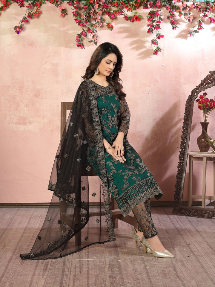 Elegant green salwar kameez set for women, perfect for wedding season.