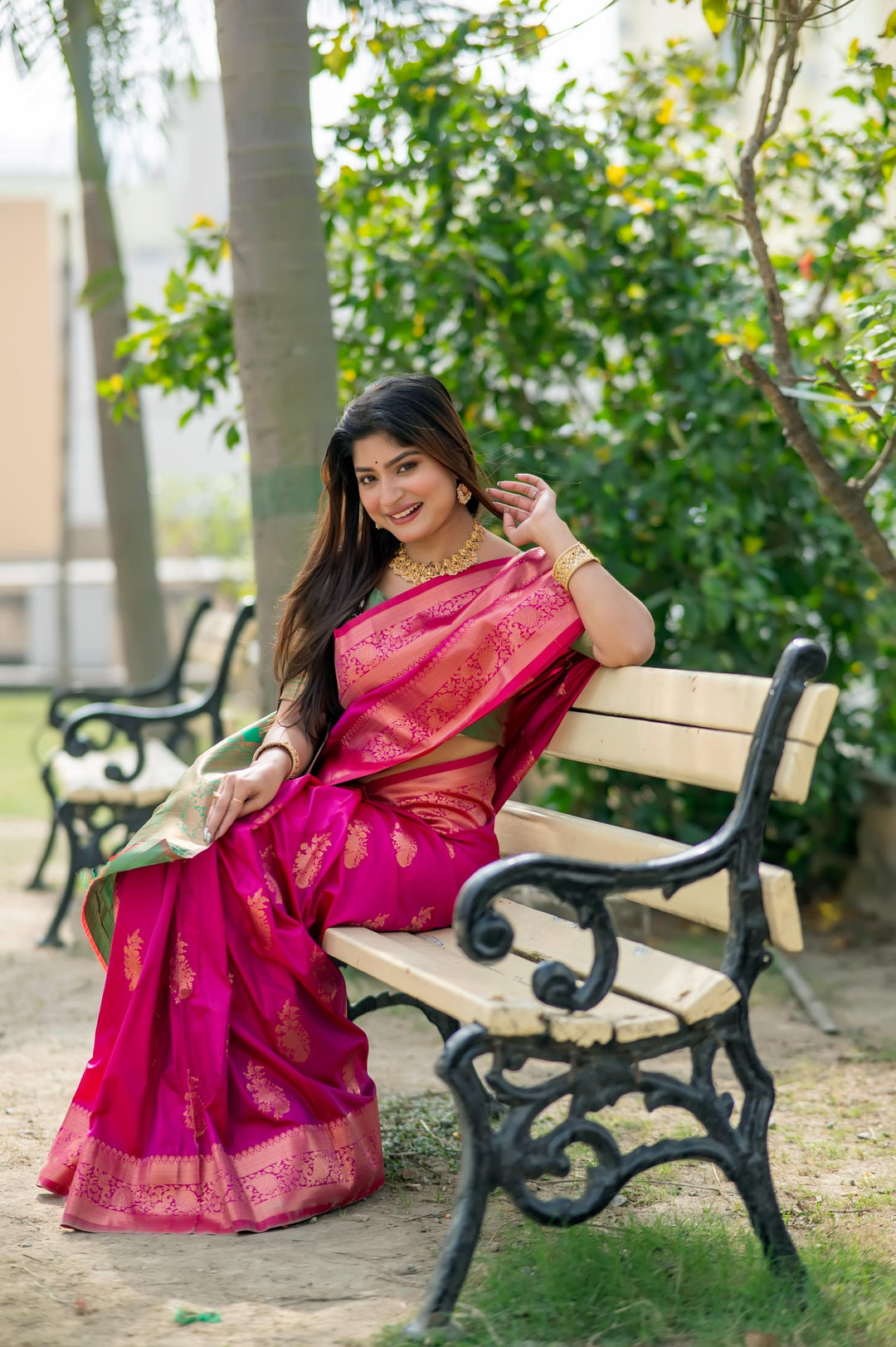 Designer Bright Pink Indian Sari, featuring intricate zari patterns and a complementary blouse piece for a complete look.