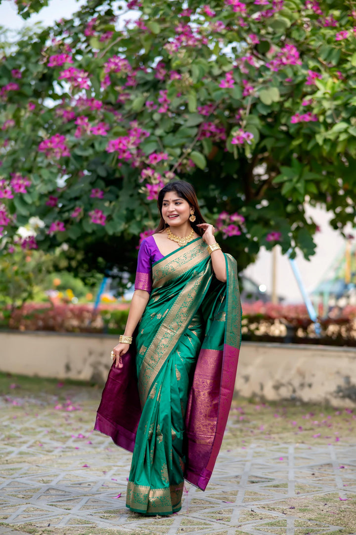 Elegant Green Banarasi Katan Silk Pattu Saree with intricate zari weaving and a stunning contrast zari pallu.