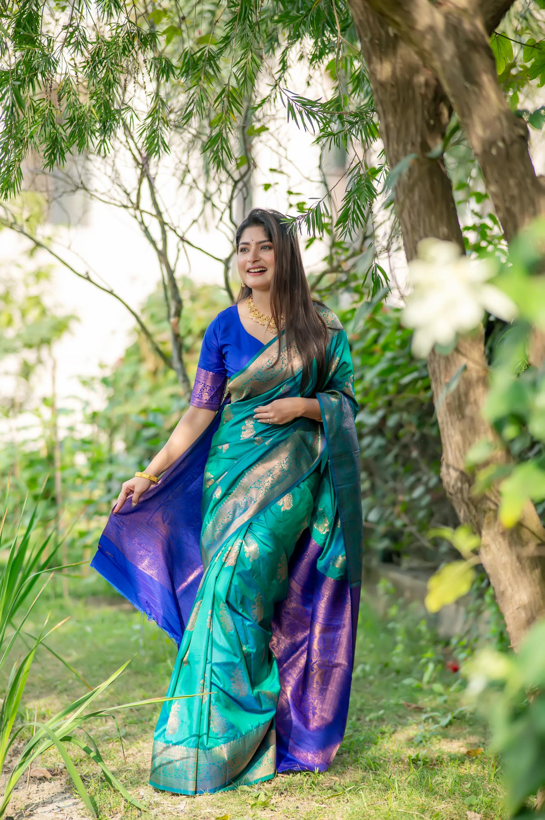 Dark Sea Green Indian Saree with rich zari work, perfect for Indian weddings and cultural events.